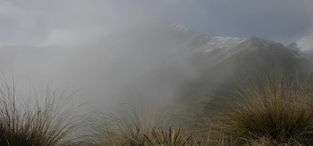 Heavy fog rolls over the mountains
