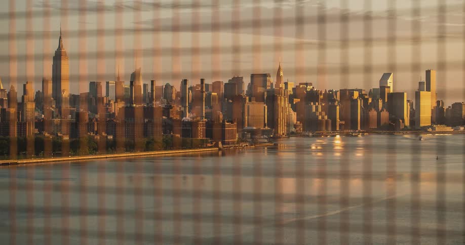 Behind this fence is new york city at dawn