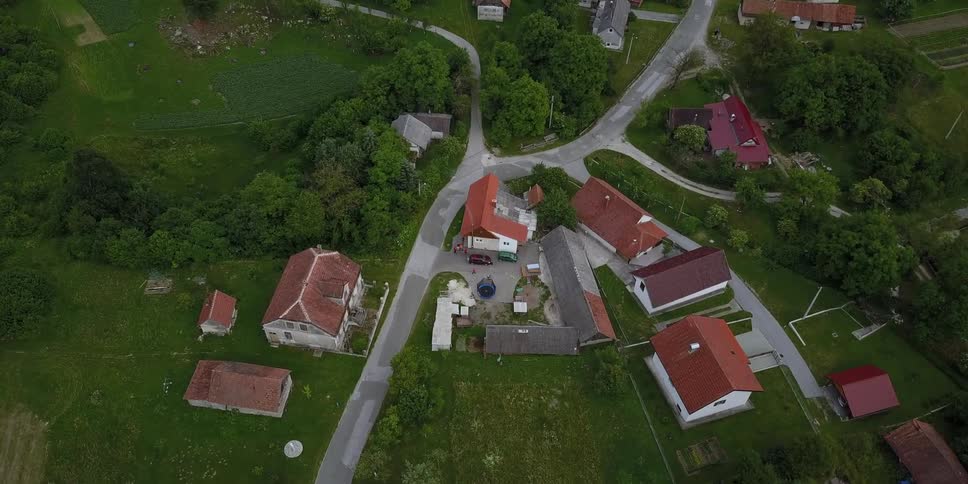 Roads pass through a quaint mountain village