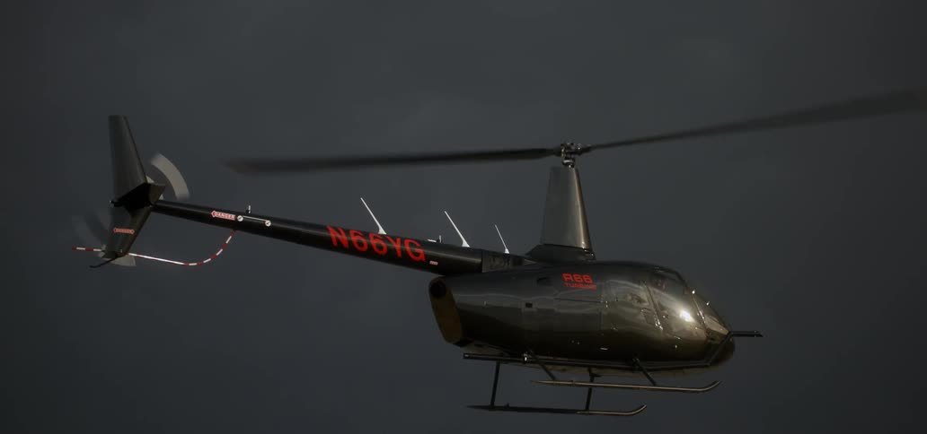 A helicopter hovers in the sky