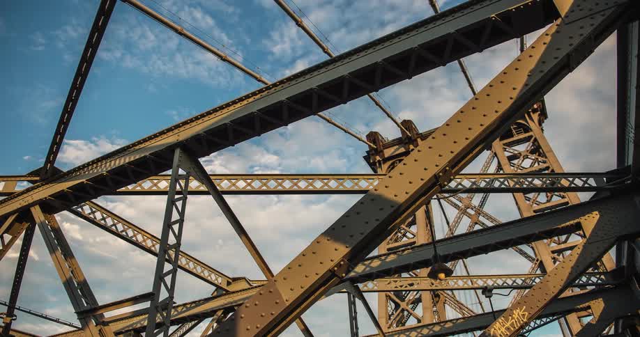 Metal structure with clouds floating above