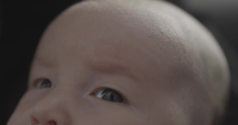 A baby is looking around