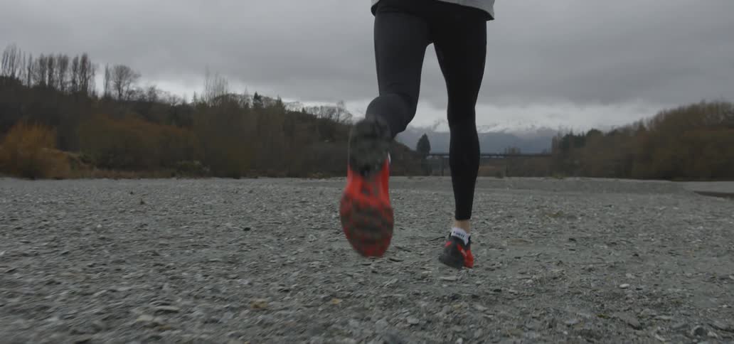 A person is running down a field