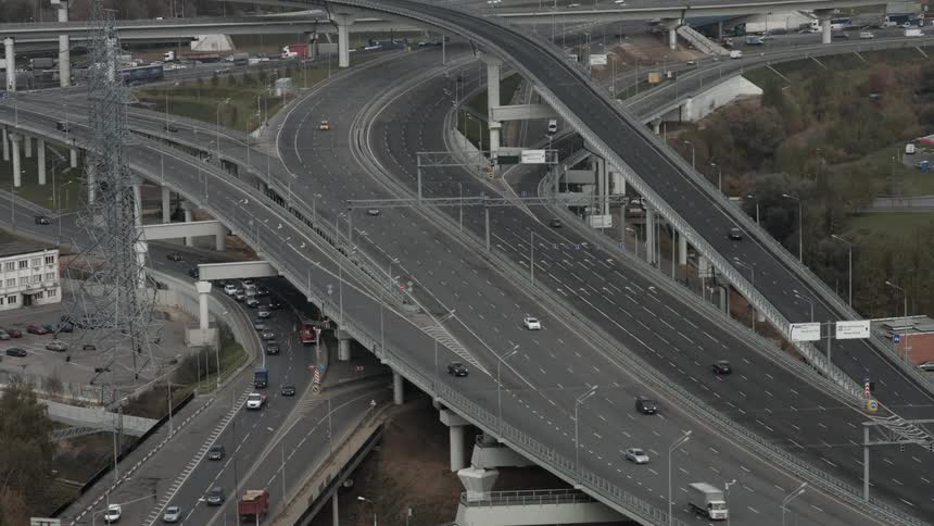 Cars drive on a city highway