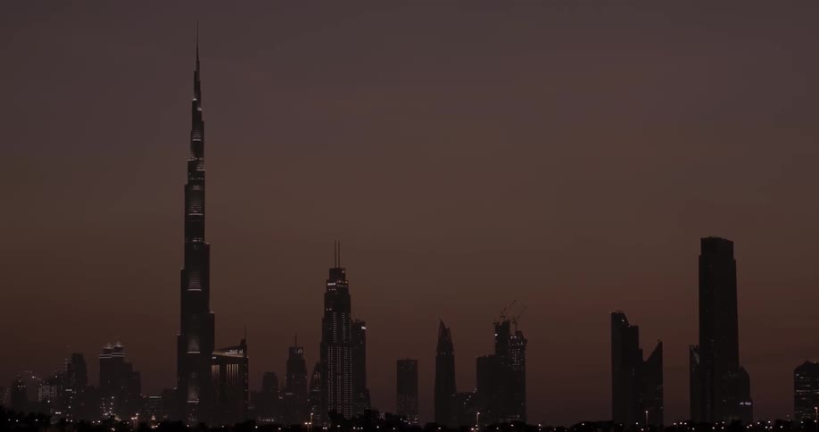 Very tall towers line this dawn sky