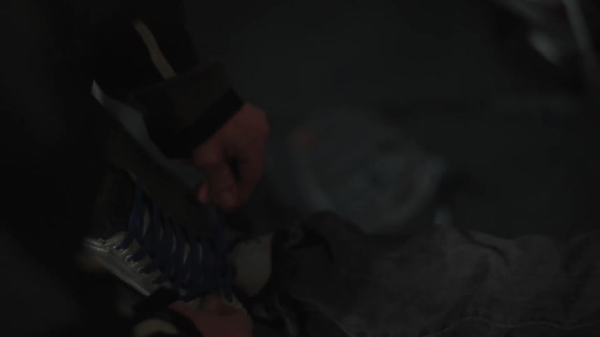 A person's shoelaces are tied