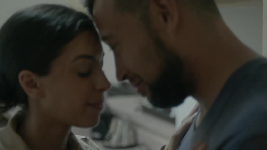 A man and woman butt heads and talk