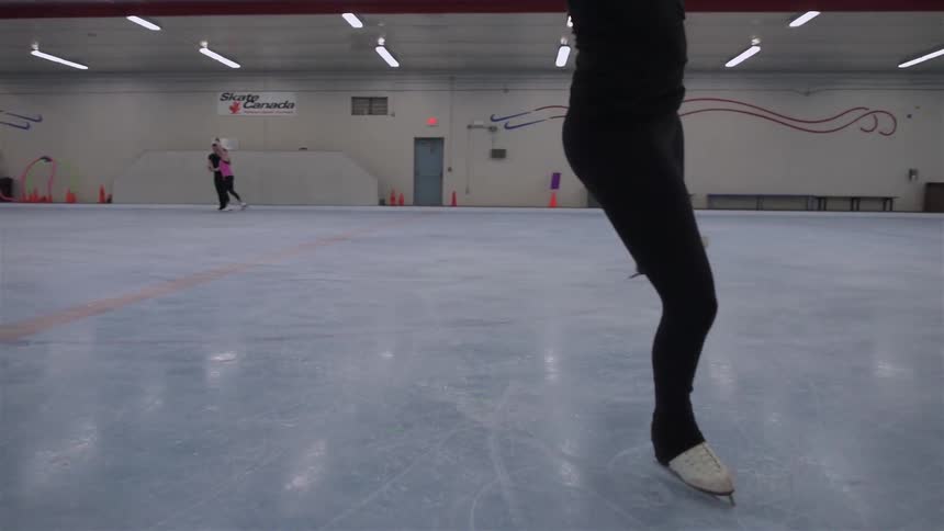 People are ice skating on a rink