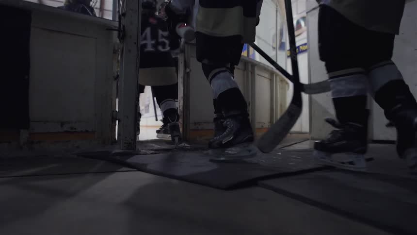 Hockey players are entering the rink together