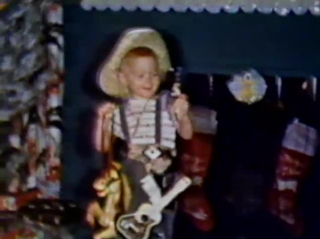 A child pulls out his toy gun