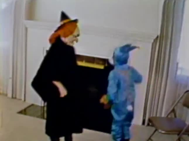 Child dressed like bugs bunny jumping around up and down