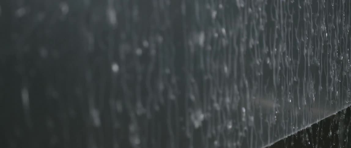 Water is pouring off the side of this wall