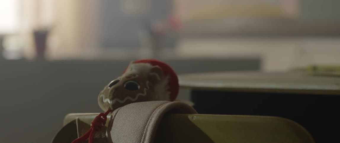 A toy sits on the side of a chair