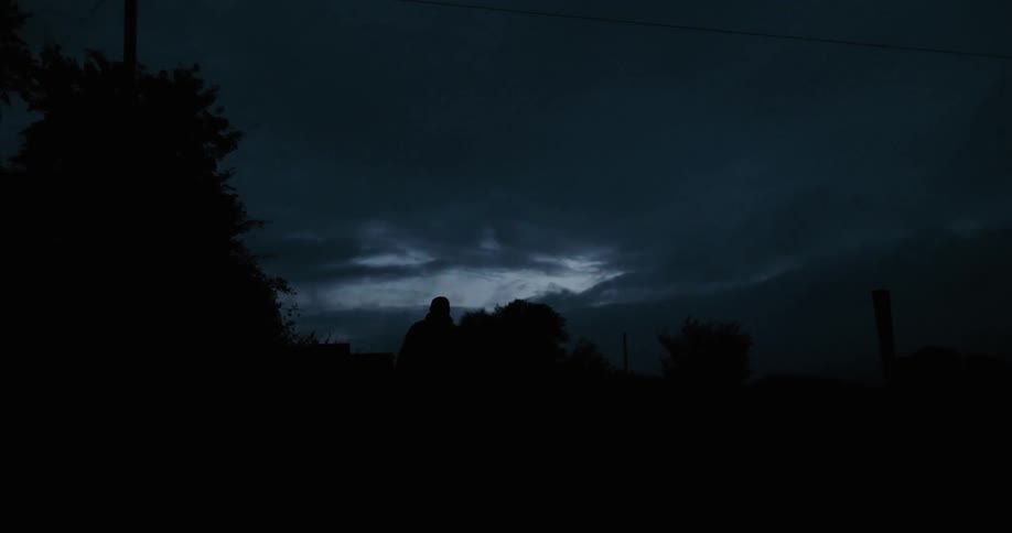 A man hikes at night