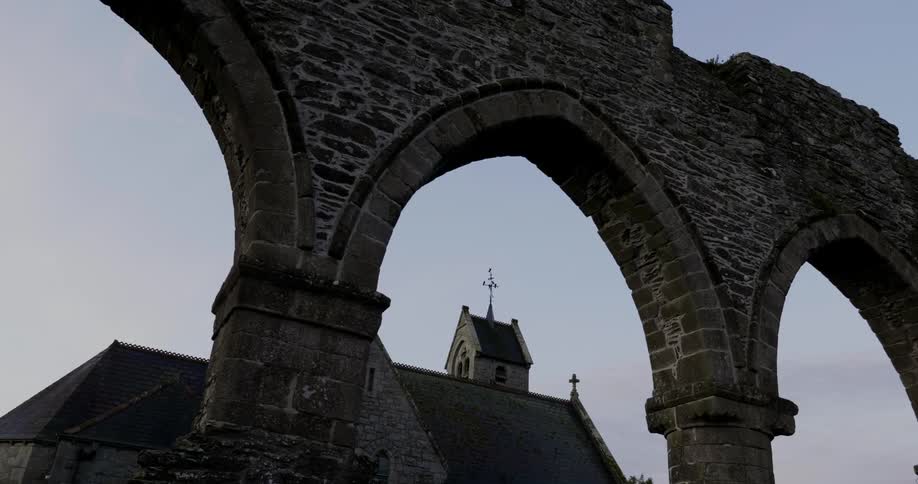 View of a stone archway and a stone building