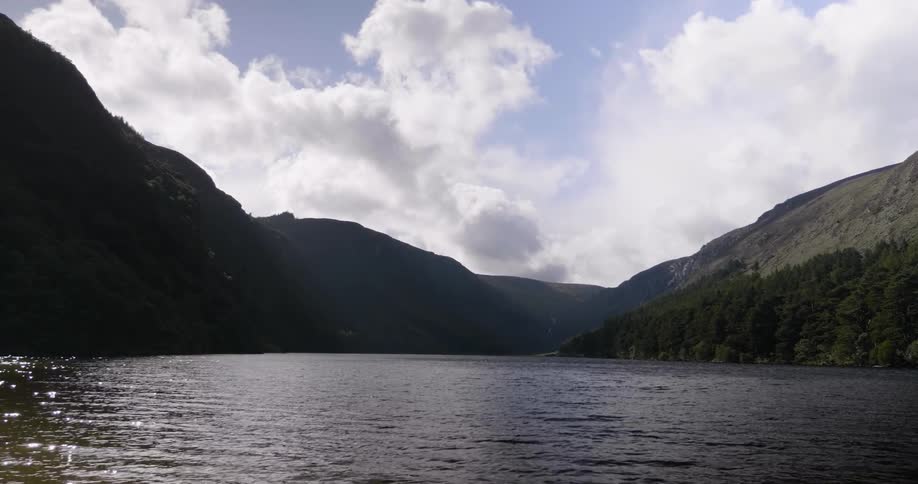 The lake has rough waters by this mountain