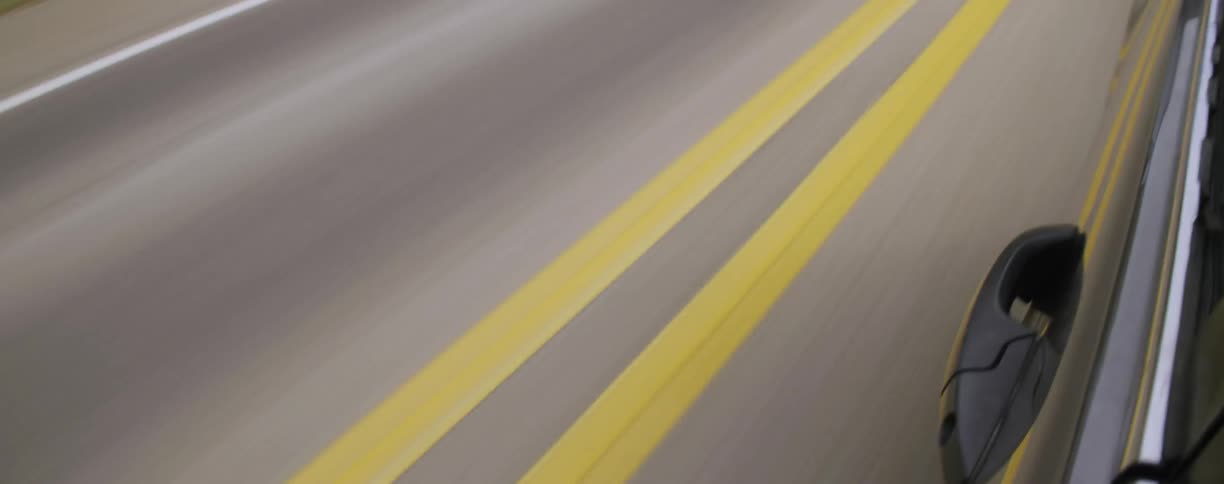 Vehicle driving down a country road