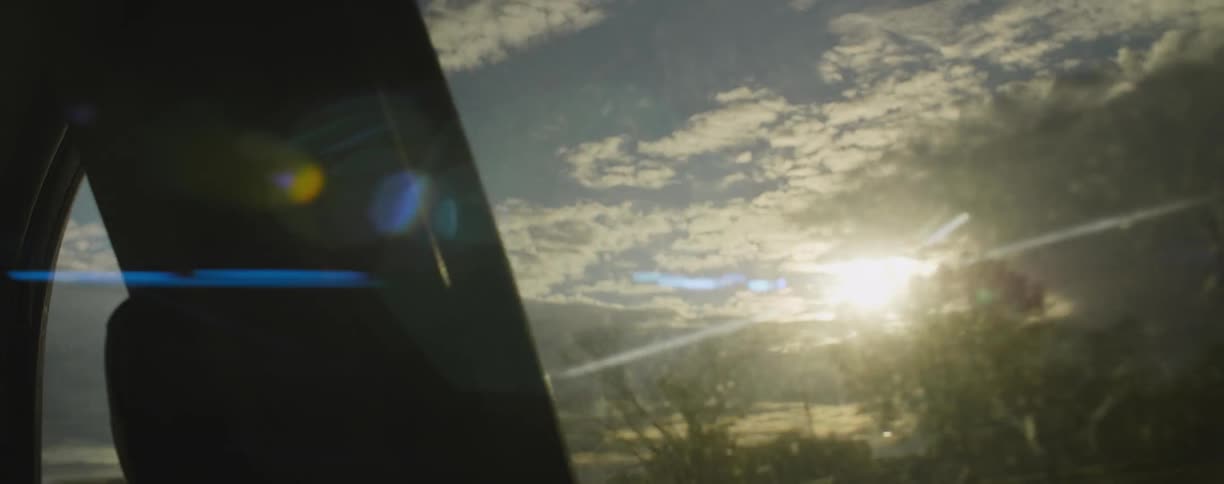 Traveling view sitting inside a vehicle going through the country