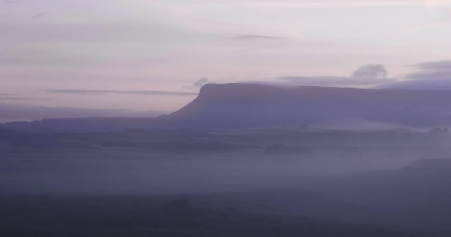 Hazy view of mountains on a cloudy day
