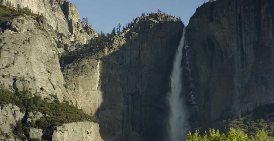 The waterfall is dropping water from very high up