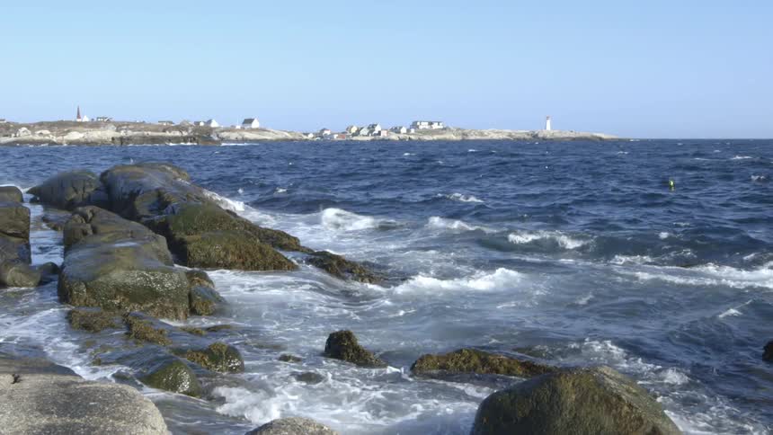 Ocean waves crashing onto a rocky shore