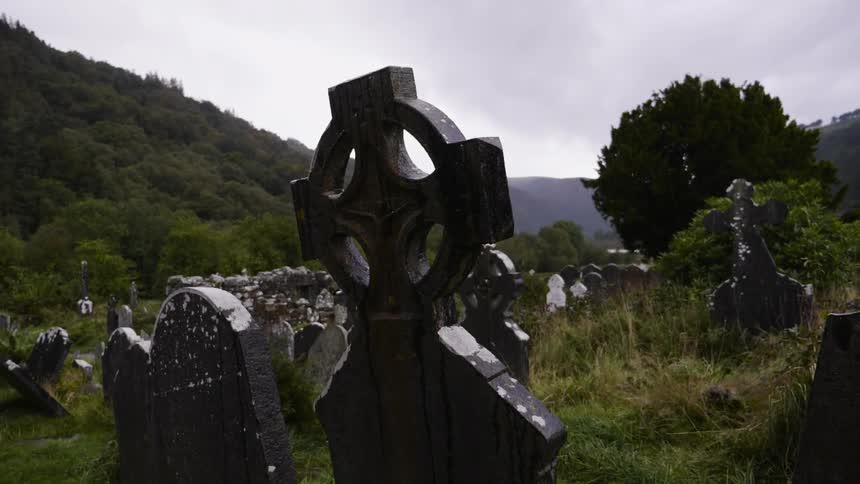 Rain falling on gravestones