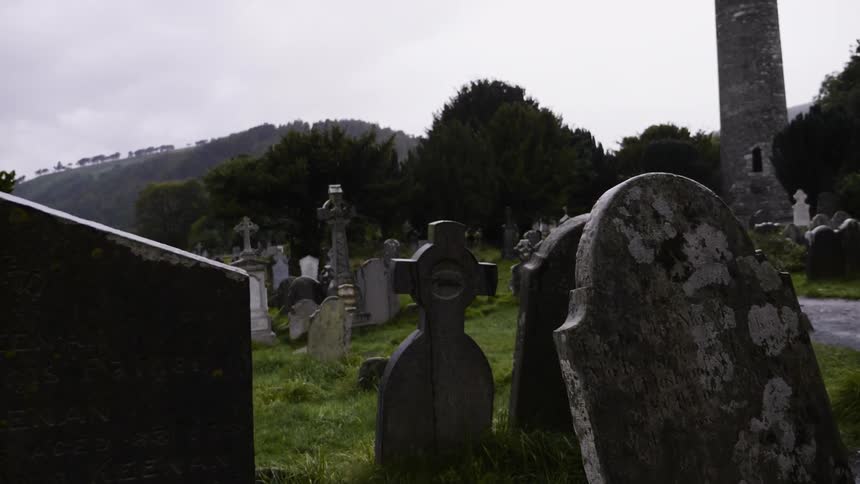 Tombstones in a graveyard on a cloudy day