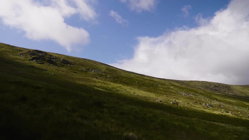View of a hillside on a cloudy day