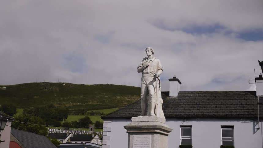 A statue of a man with a walking stick
