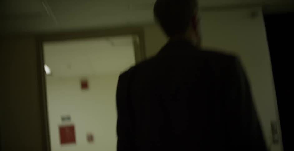 A person walking through a house looking for something