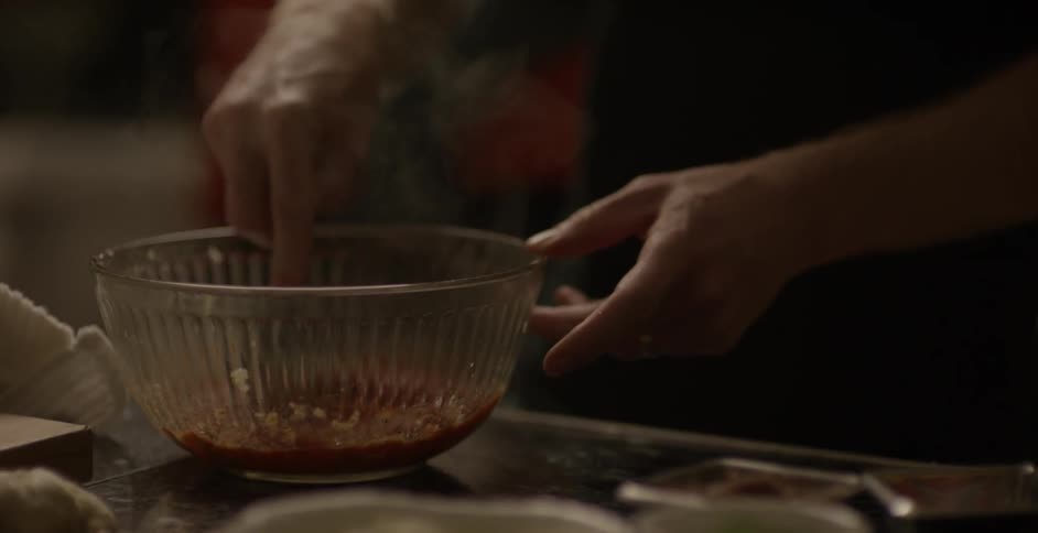 Food is mixed in a glass bowl