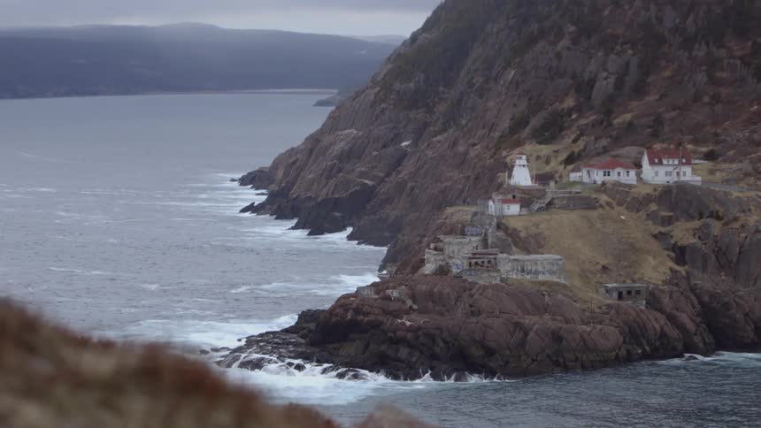 Waves crashing onto a seaside cliff
