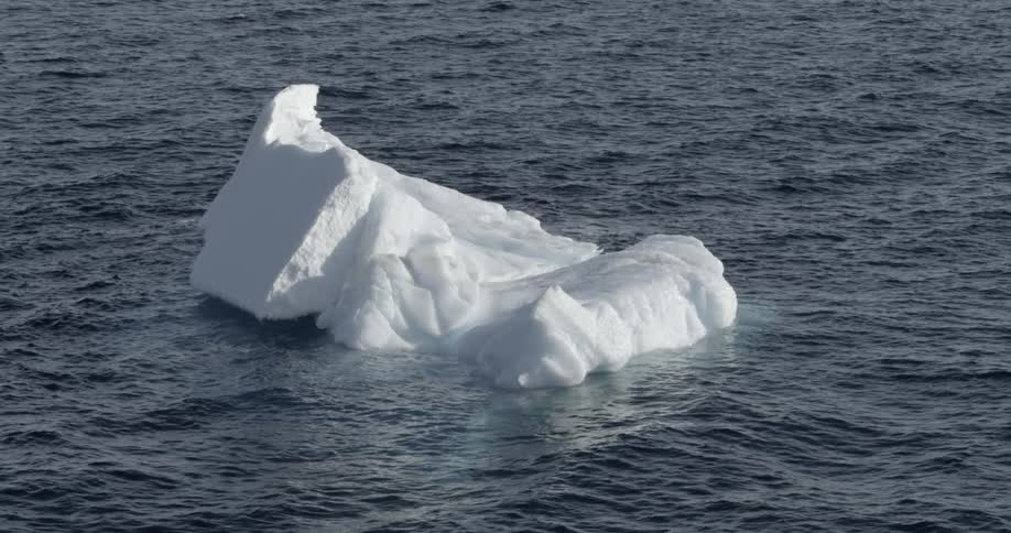 An Iceberg floating alone in the ocean