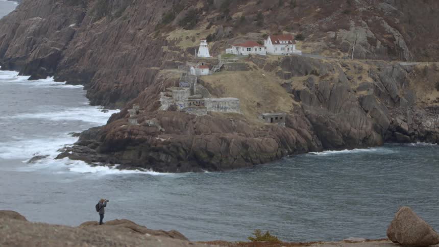 Man photographing the ocean
