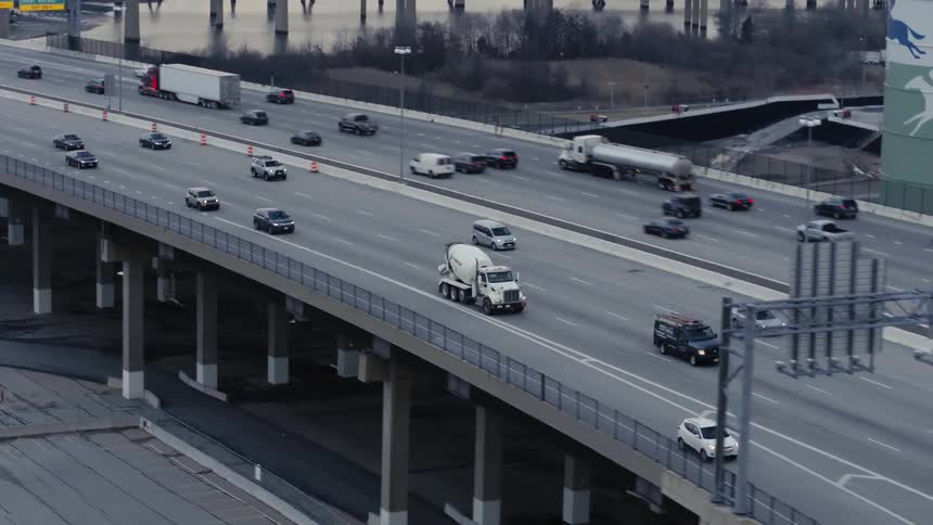 The highway is busy with many cars commuting