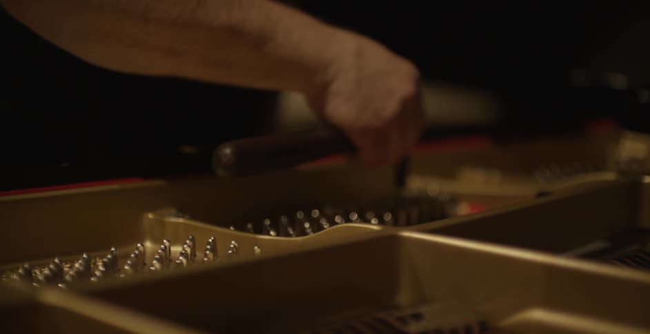 Person fixing on a piano