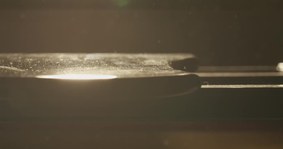 The piano has dust flying around it