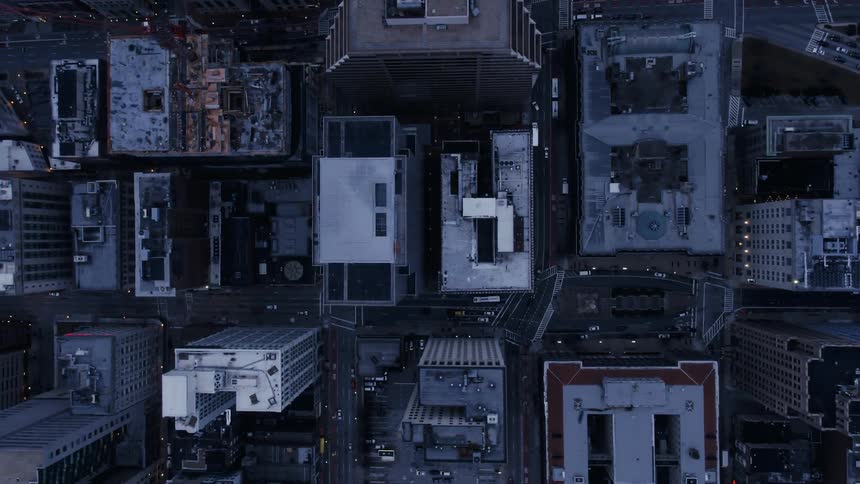 An overhead view of some building roofs and roads