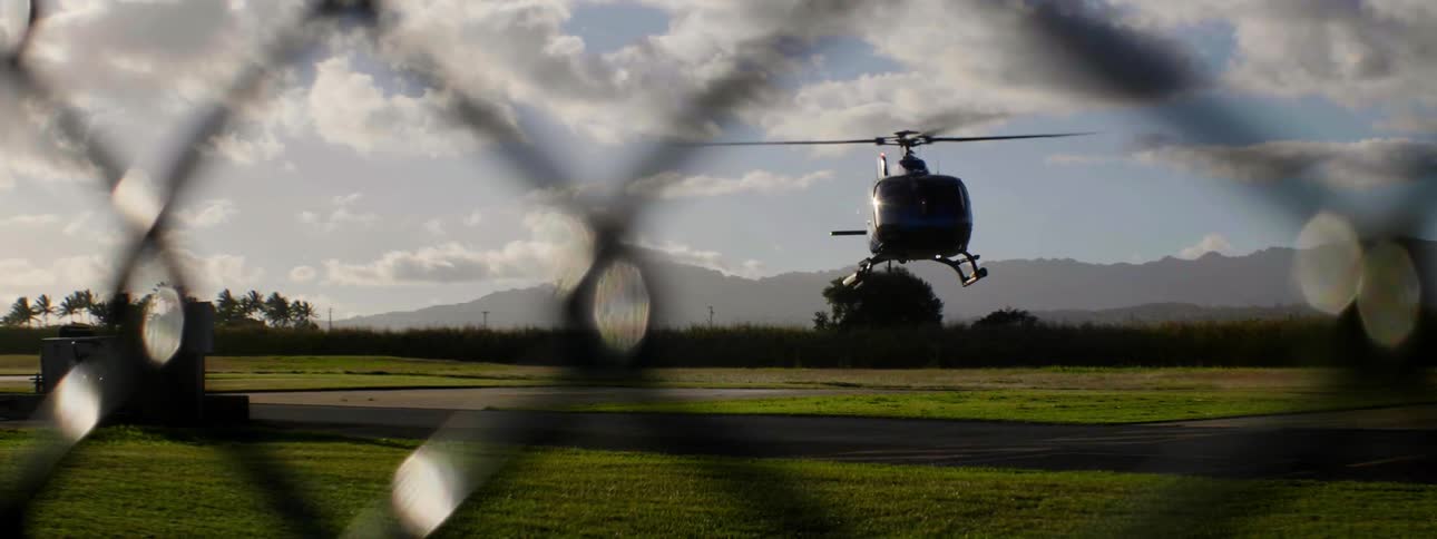 Helicopter taking off over plains