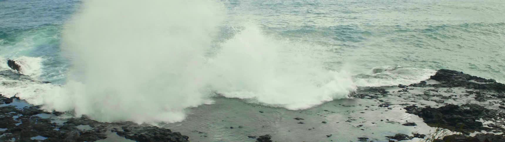 Waves crash against a rocky beach