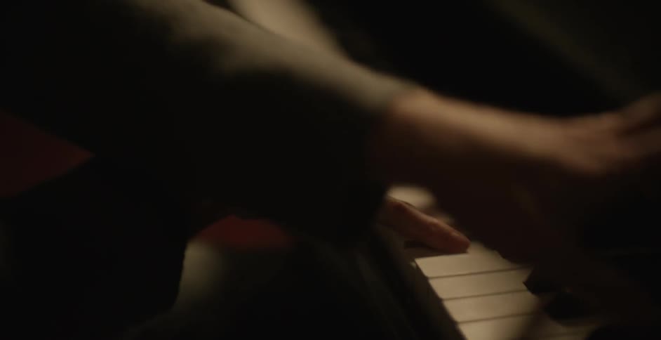 Close up of a person playing the piano