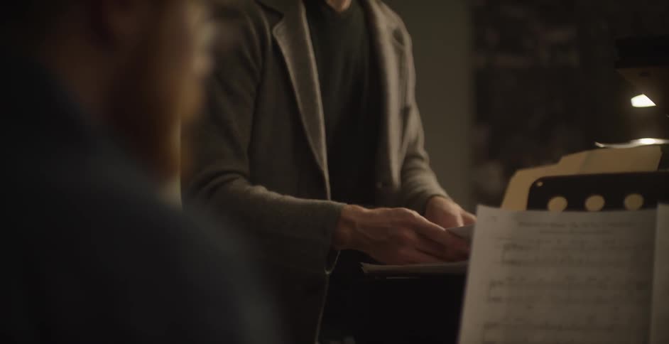 A person sorts through sheet music