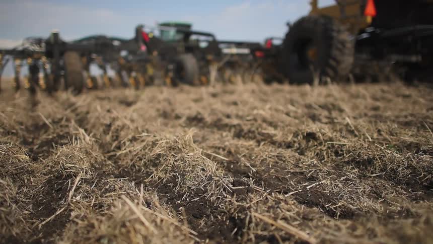 A farm vehicle is working the land