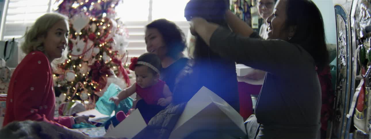 A family is opening christmas presents