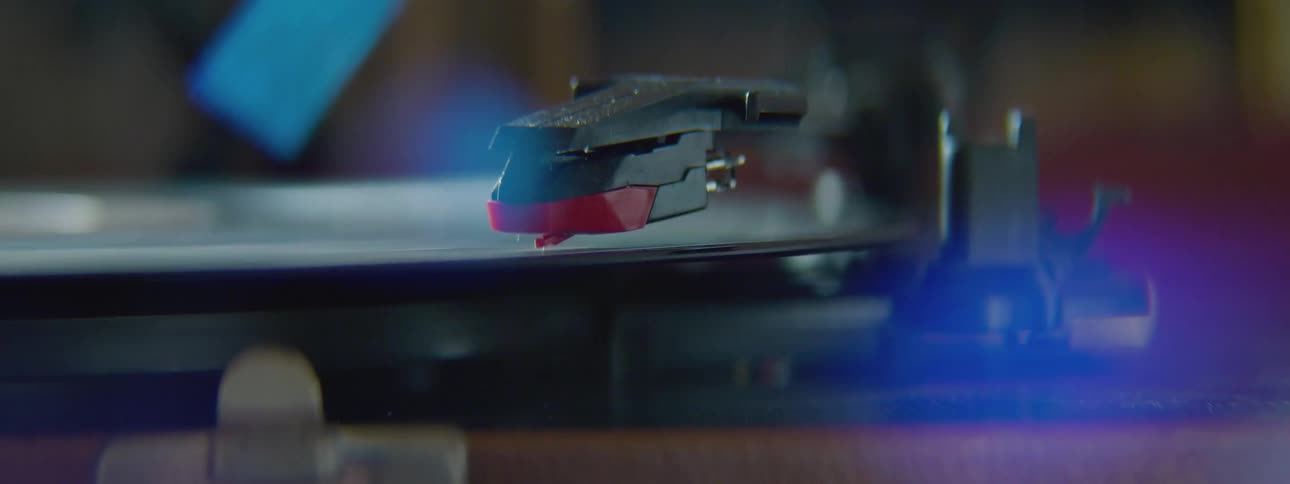 A record is spinning then the needle is put on