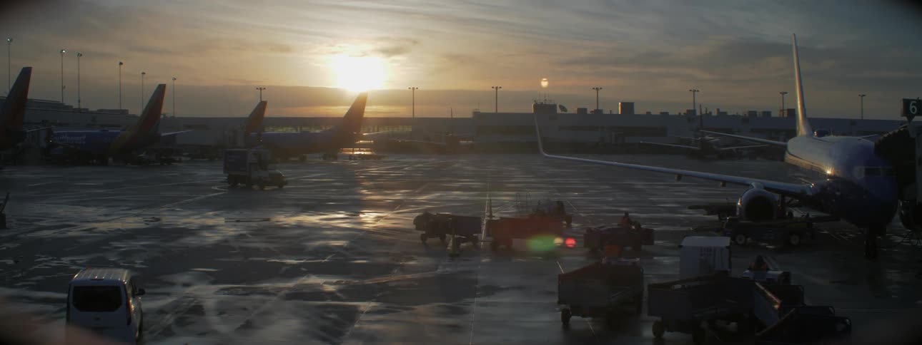 Vehicles drive around a plane hangar