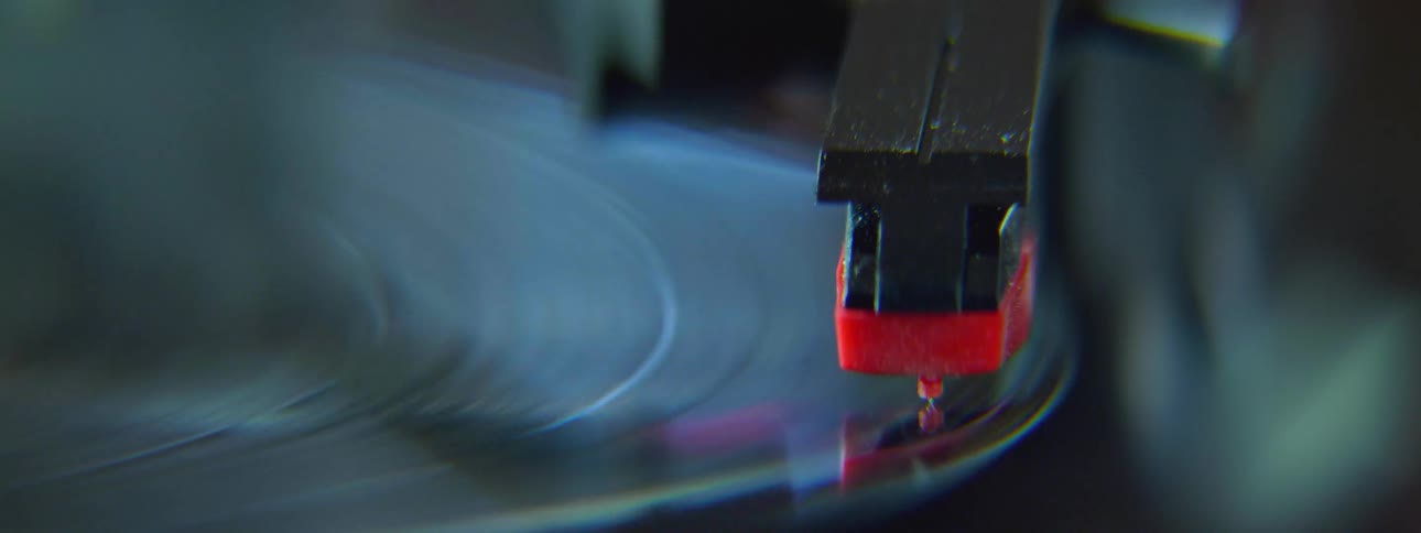 Needle being placed on a spinning record