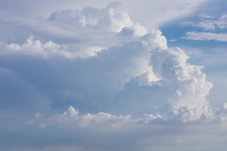 The sky is full of clouds moving around