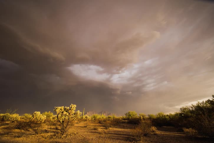 A strong storm with light blowing dust