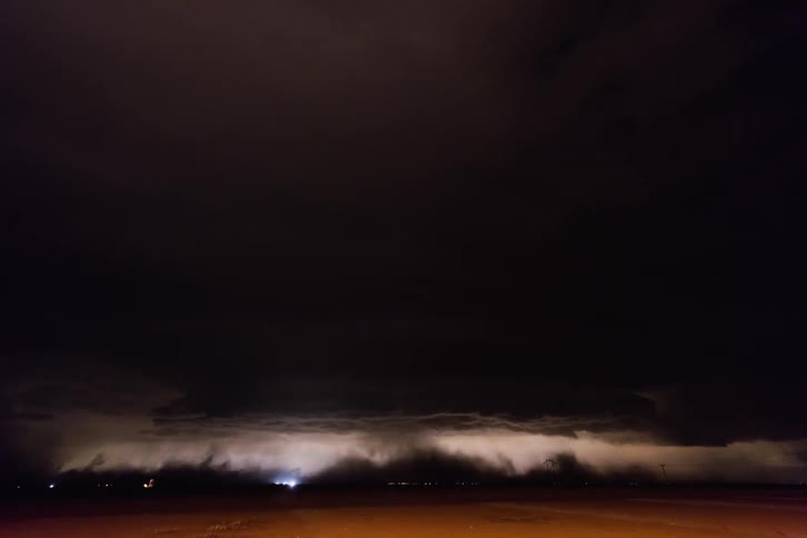 A storm rolls over a city